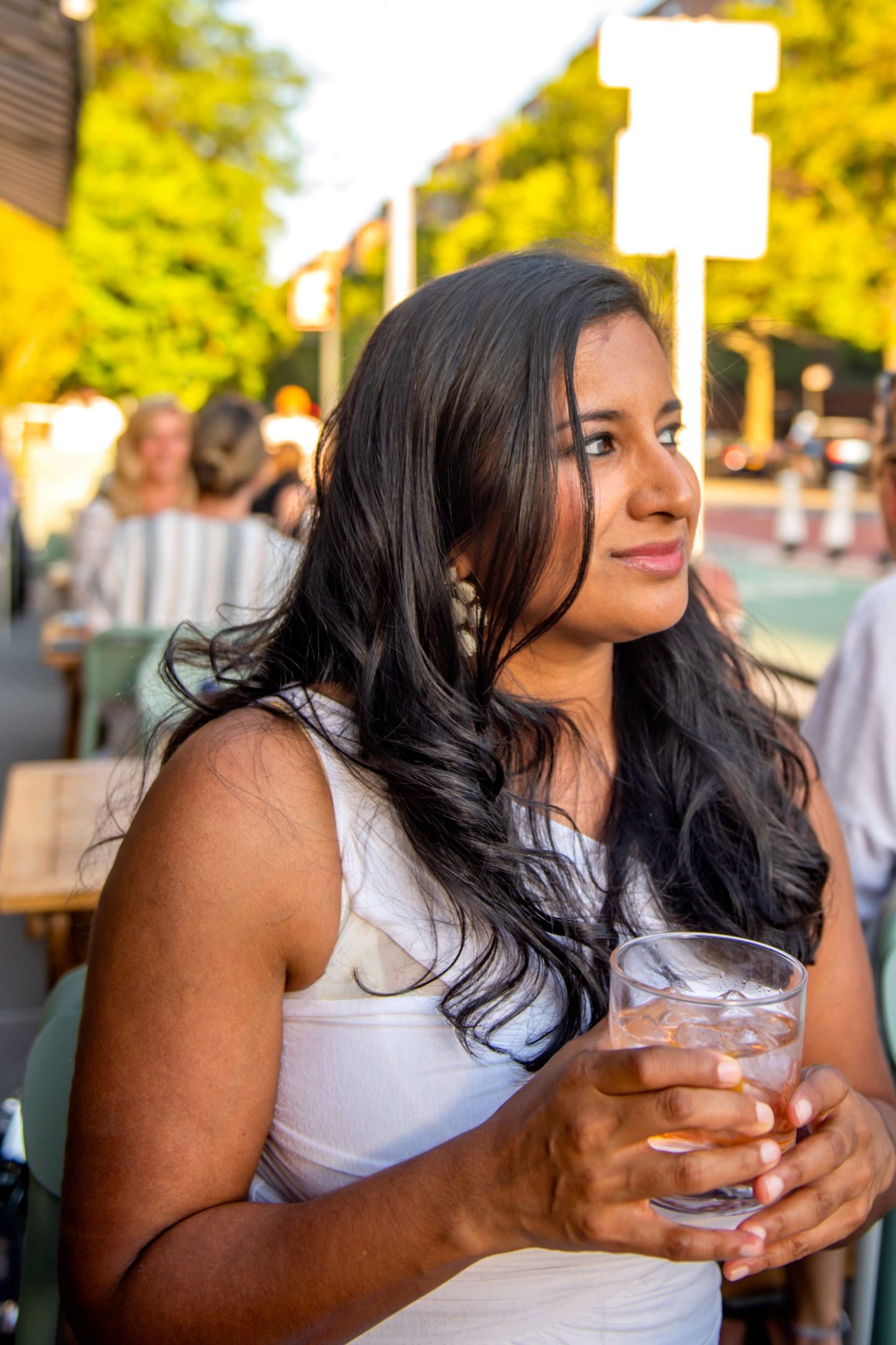 The Best Restaurants in StuyTown in 2021: Rosemary's East Rosemary’s East – Woman Sipping Pink Negroni. Best Restaurants in StuyTown.