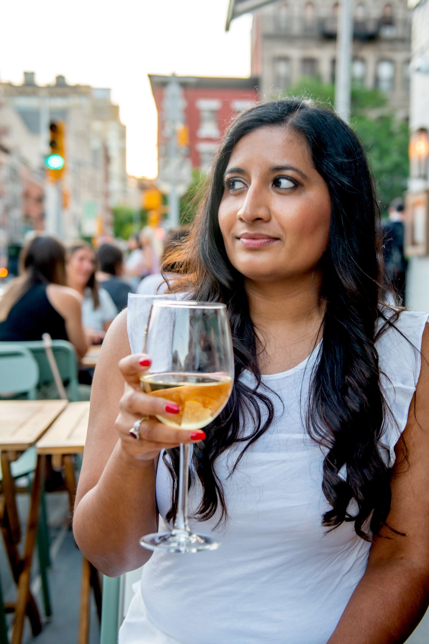 The Best Restaurants in StuyTown in 2021: Rosemary's East Rosemary’s East – Woman Sipping White Wine. Best Restaurants in StuyTown