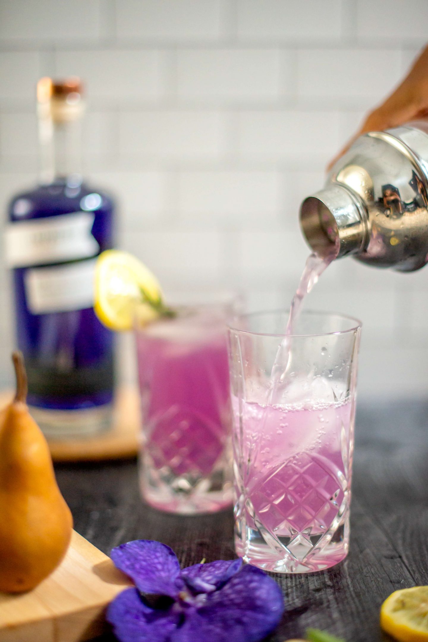 7 Ingredients to Make Beautiful Empress Gin Cocktails with Pear and Rosemary Mixing Pear Rosemary Lemon Cocktail, Empress Gin Cocktails. Purple cocktail.