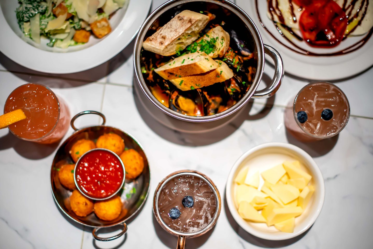 The Best Group Dining in Hudson Square 2021: Adoro Lei Adoro Lei Truffle Rice Balls, Mozzarella Caprese, Caesar Salad, Prosecco Mussels and Cocktails. Best Group Dining in Hudson Square.