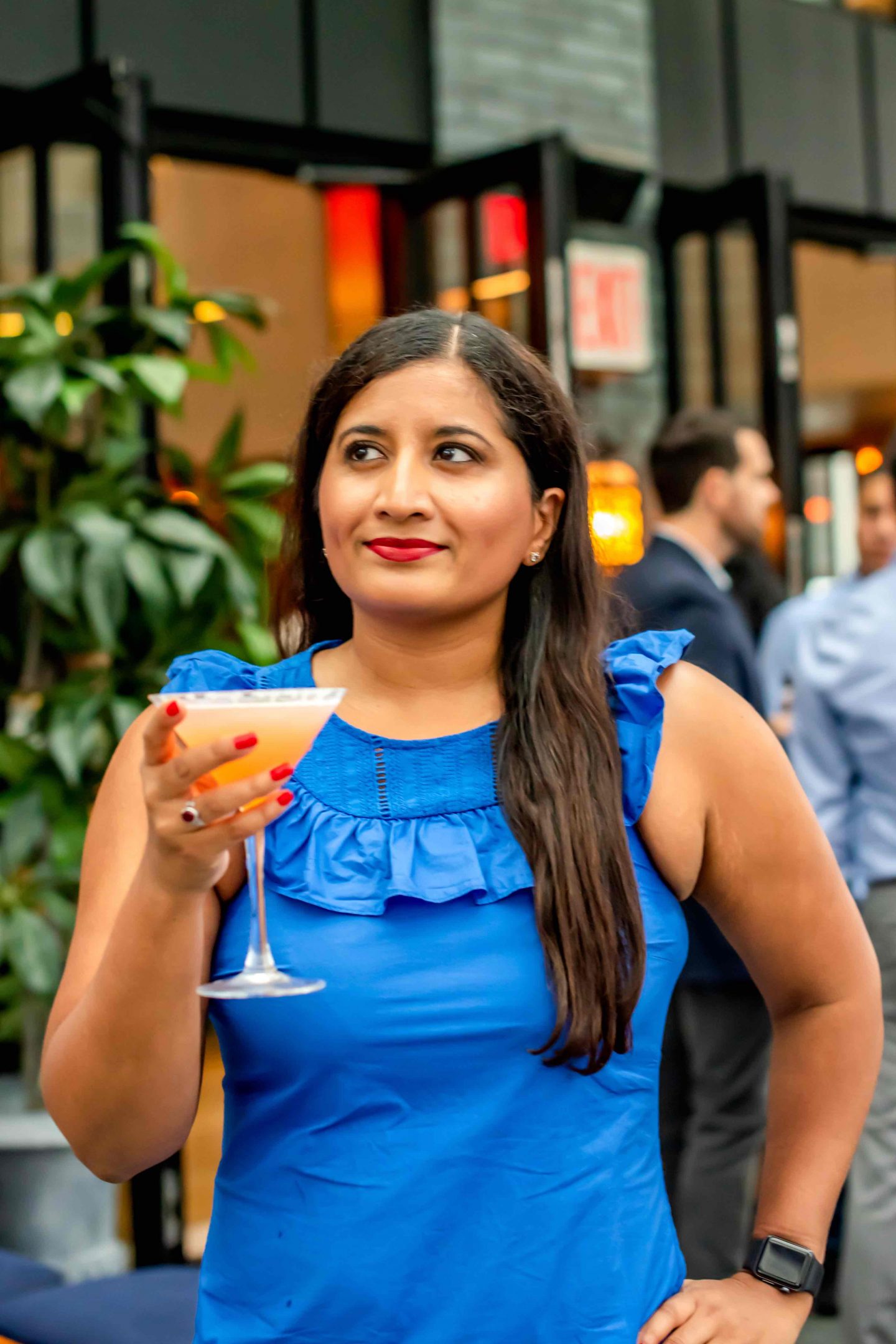 Elsie Rooftop Woman with a Strawberry Rebel Cocktail.  Best rooftops in Midtown in 2022. 