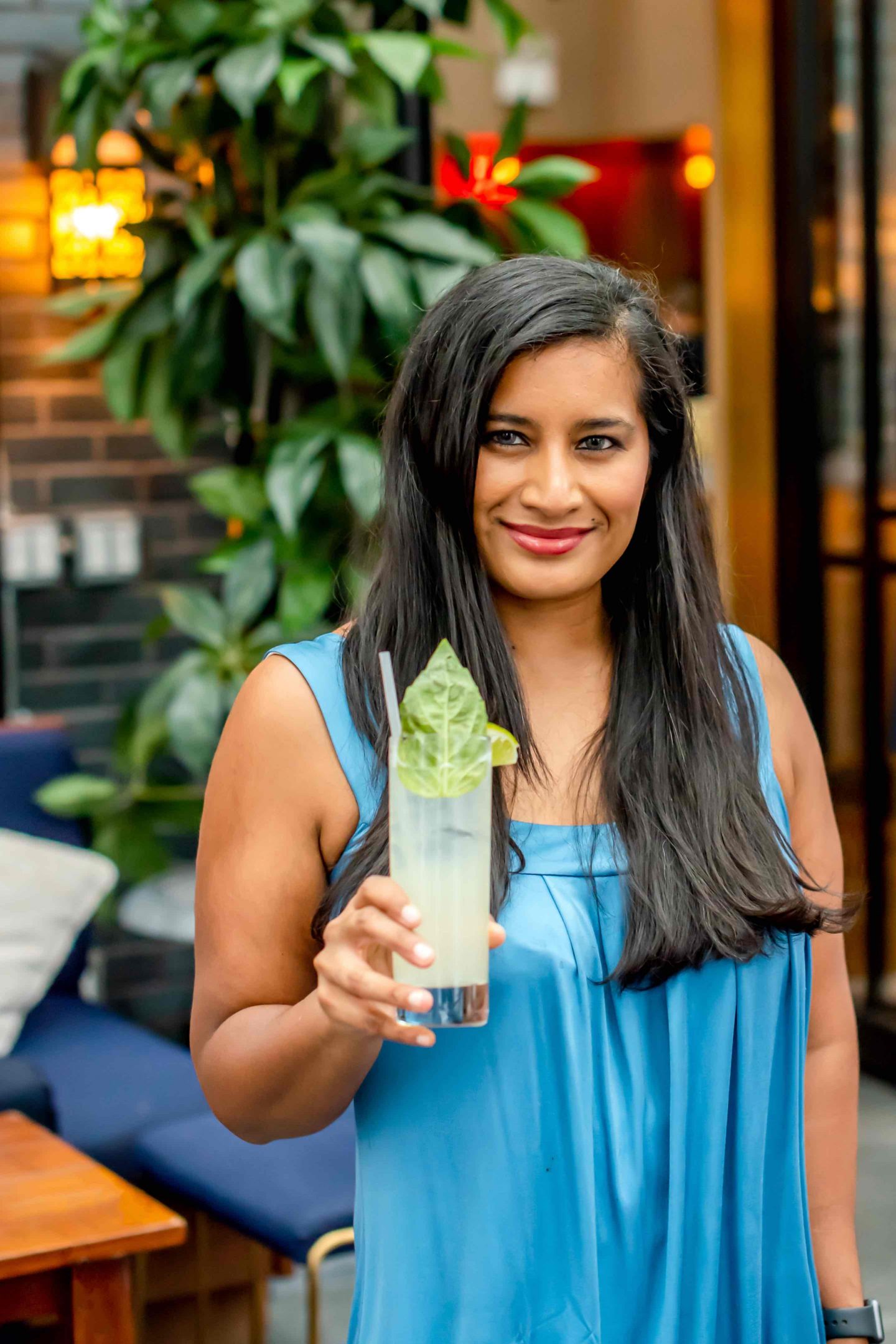 Elsie Rooftop Woman with a Cocktail.  Best rooftops in Midtown in 2022. 