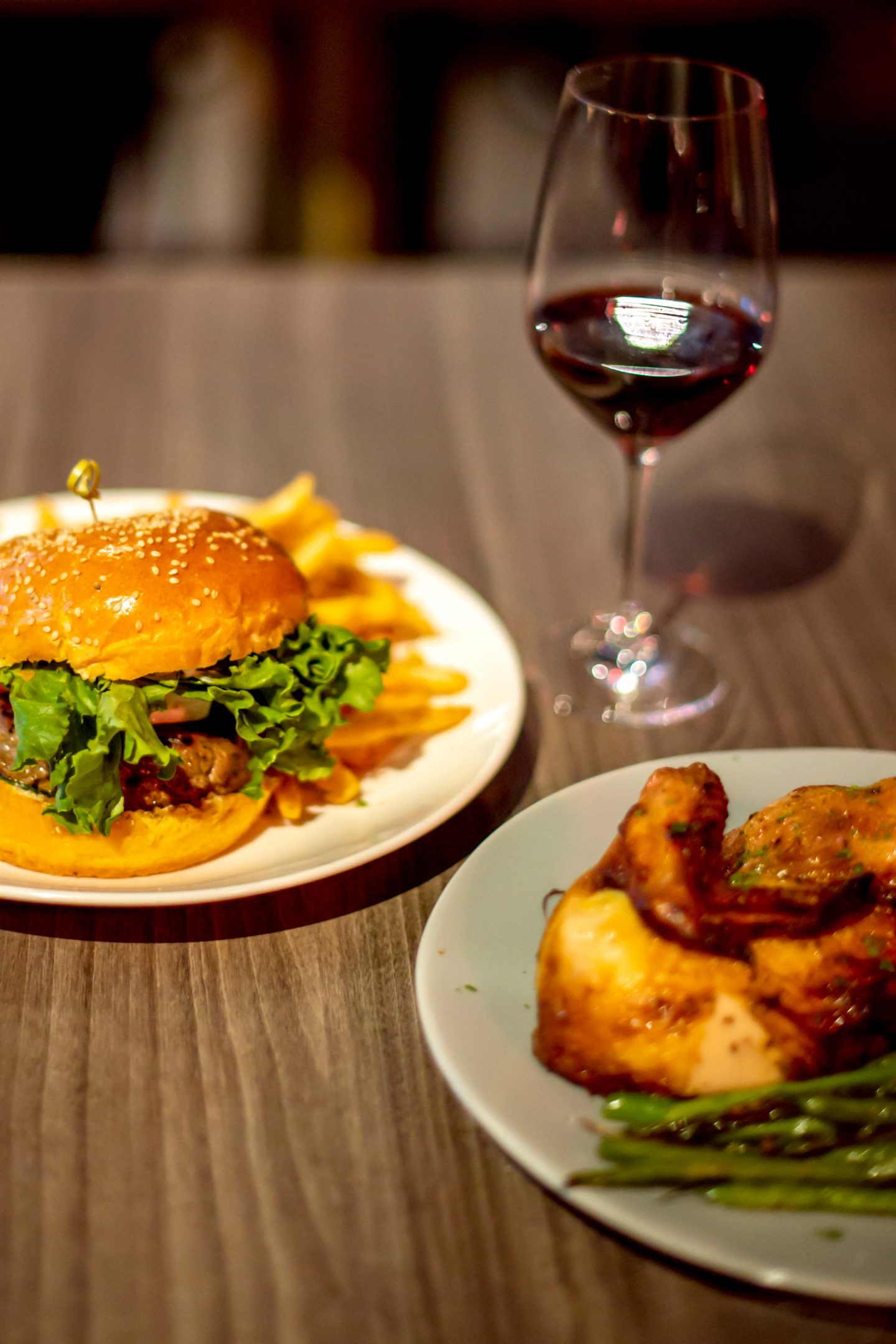 Versa Rooftop. Lamb Burger with Fries, 1/2 Chicken and Red Wine. Best Rooftops in Midtown Manhattan.