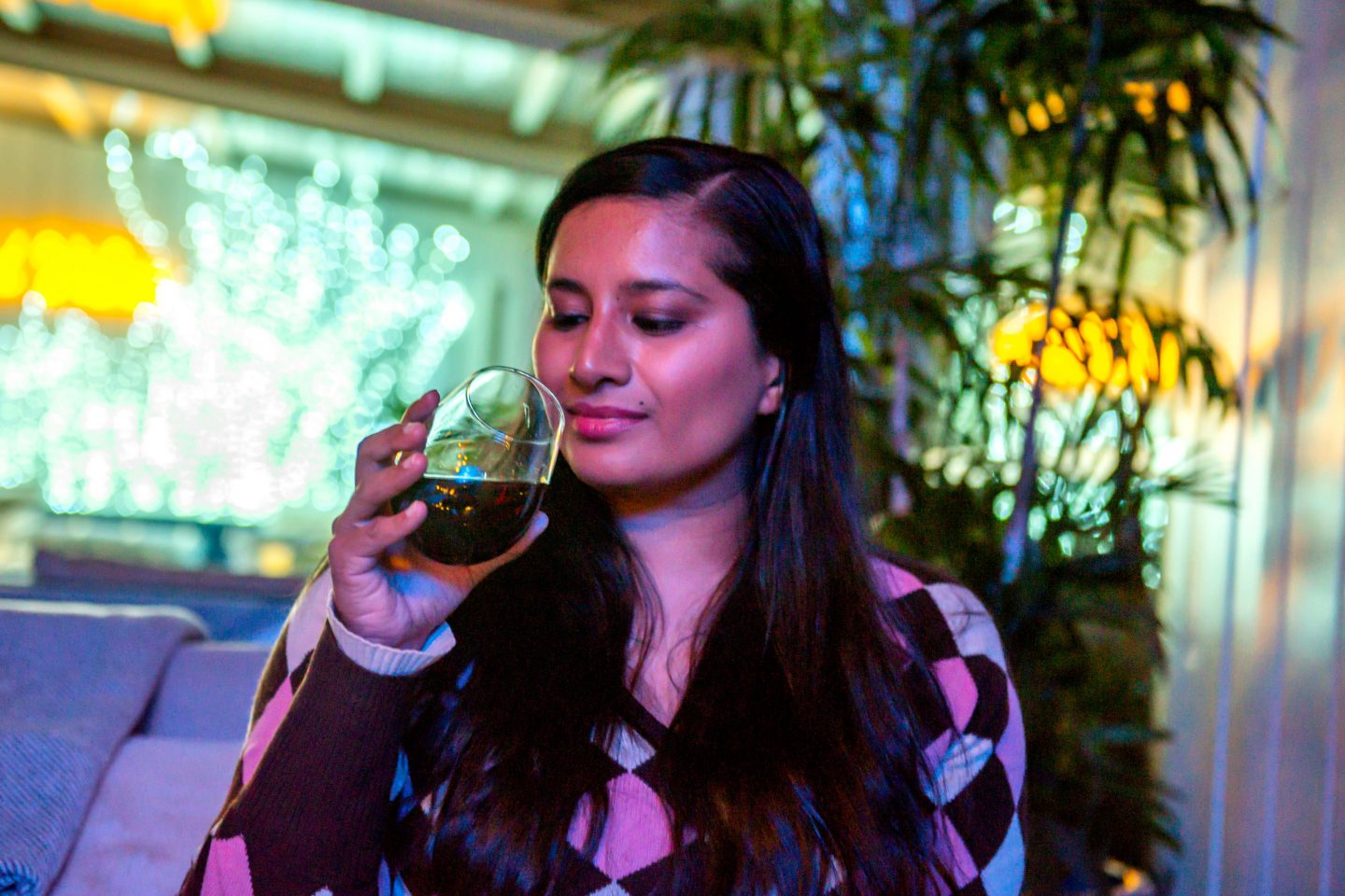 The Best Winter Rooftop Bars in NYC in 2022: Sandbar Sandbar Woman Sipping Wine. Best Winter Rooftop Bars in NYC. Sandbar Rooftop.