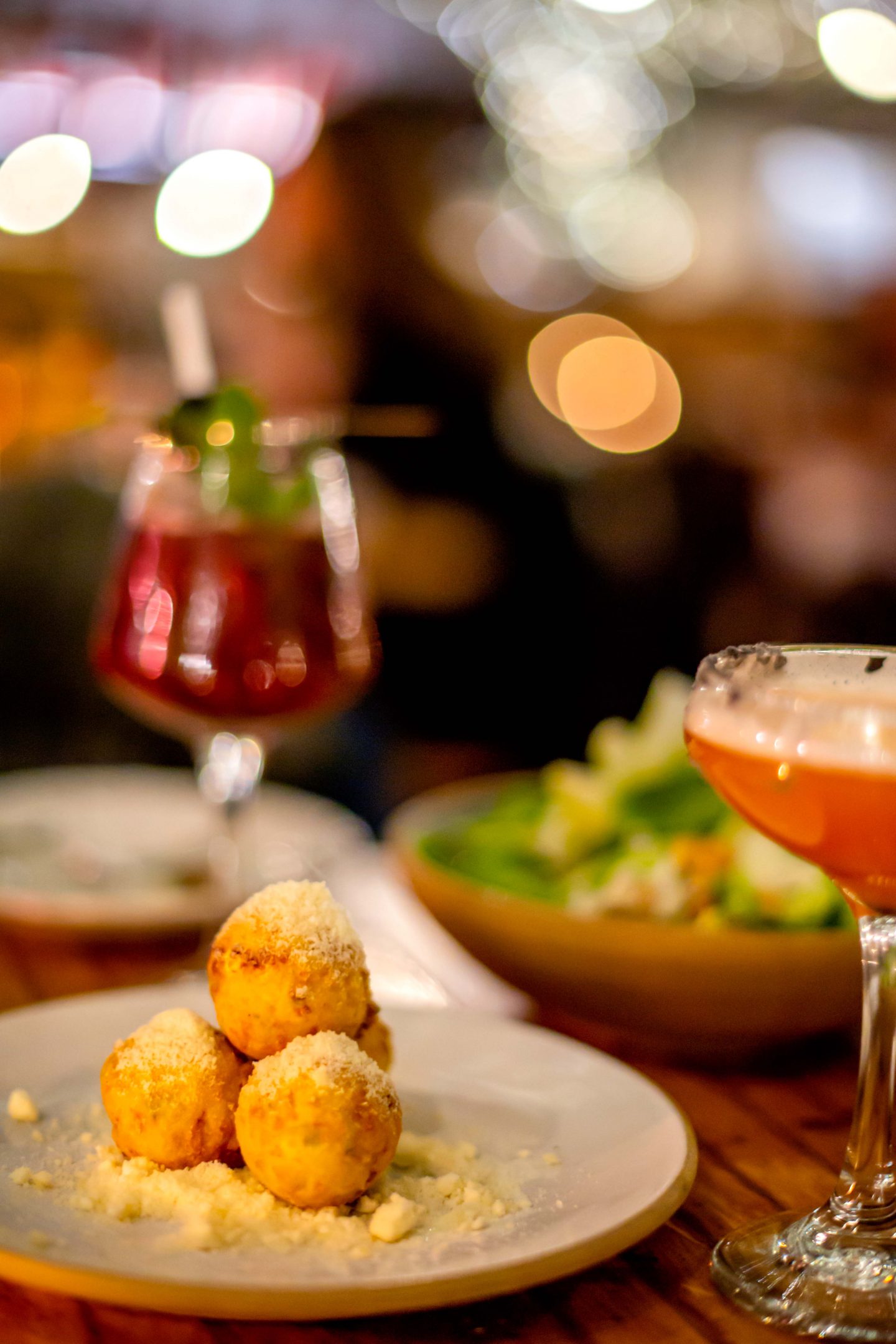 The Best Winter Rooftops in NYC in 2022: Eataly Flatiron Arancini, Pear Salad and Cocktails at Eataly Flatiron. Best Winter Rooftops in NYC.