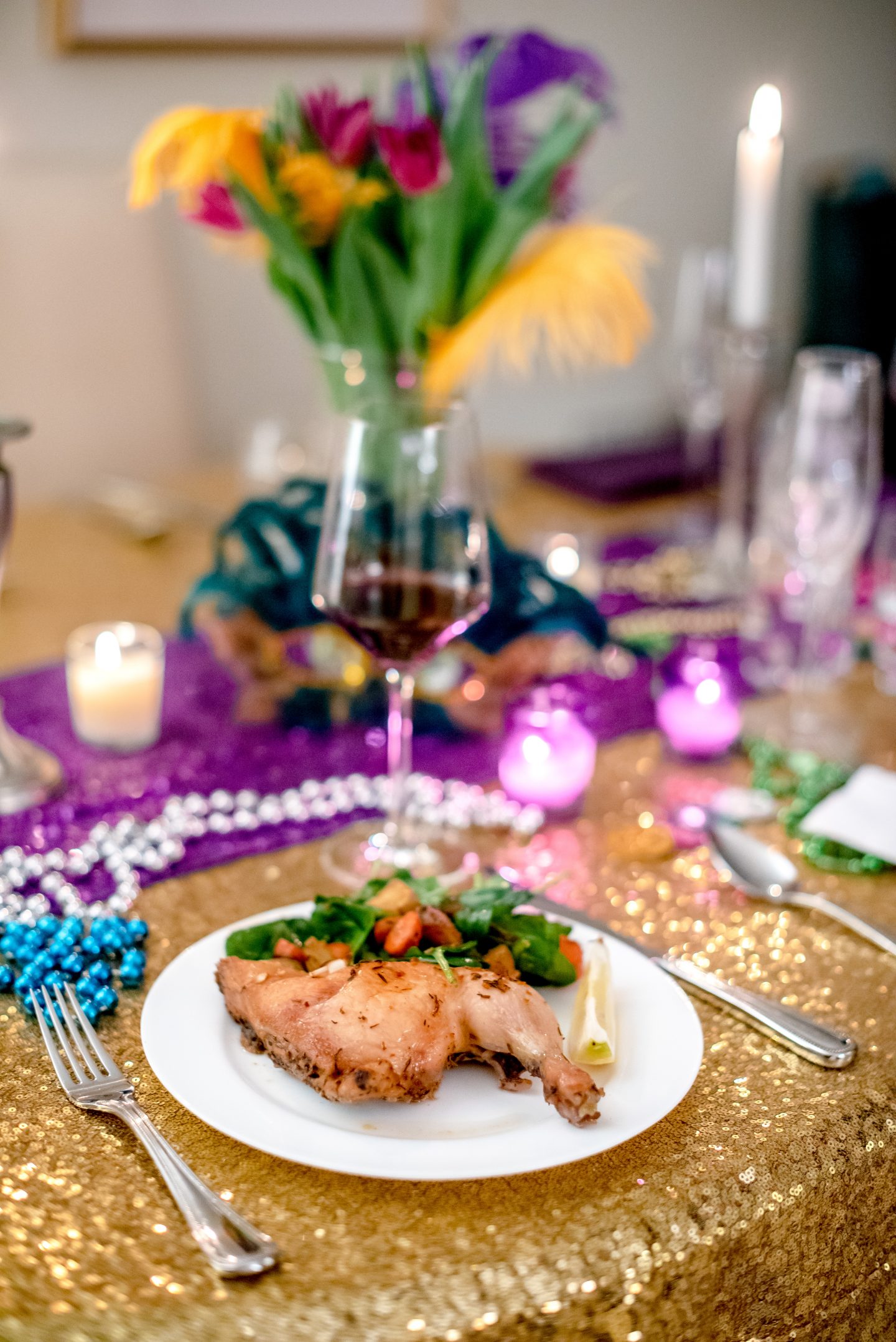 Ideas for a Mardi Gras Party. Mardi Gras decorations. Mardi Gras dinner party. Mardi Gras tablescape. Mardi Gras food ideas. Roasted chicken with warm spinach salad. 
