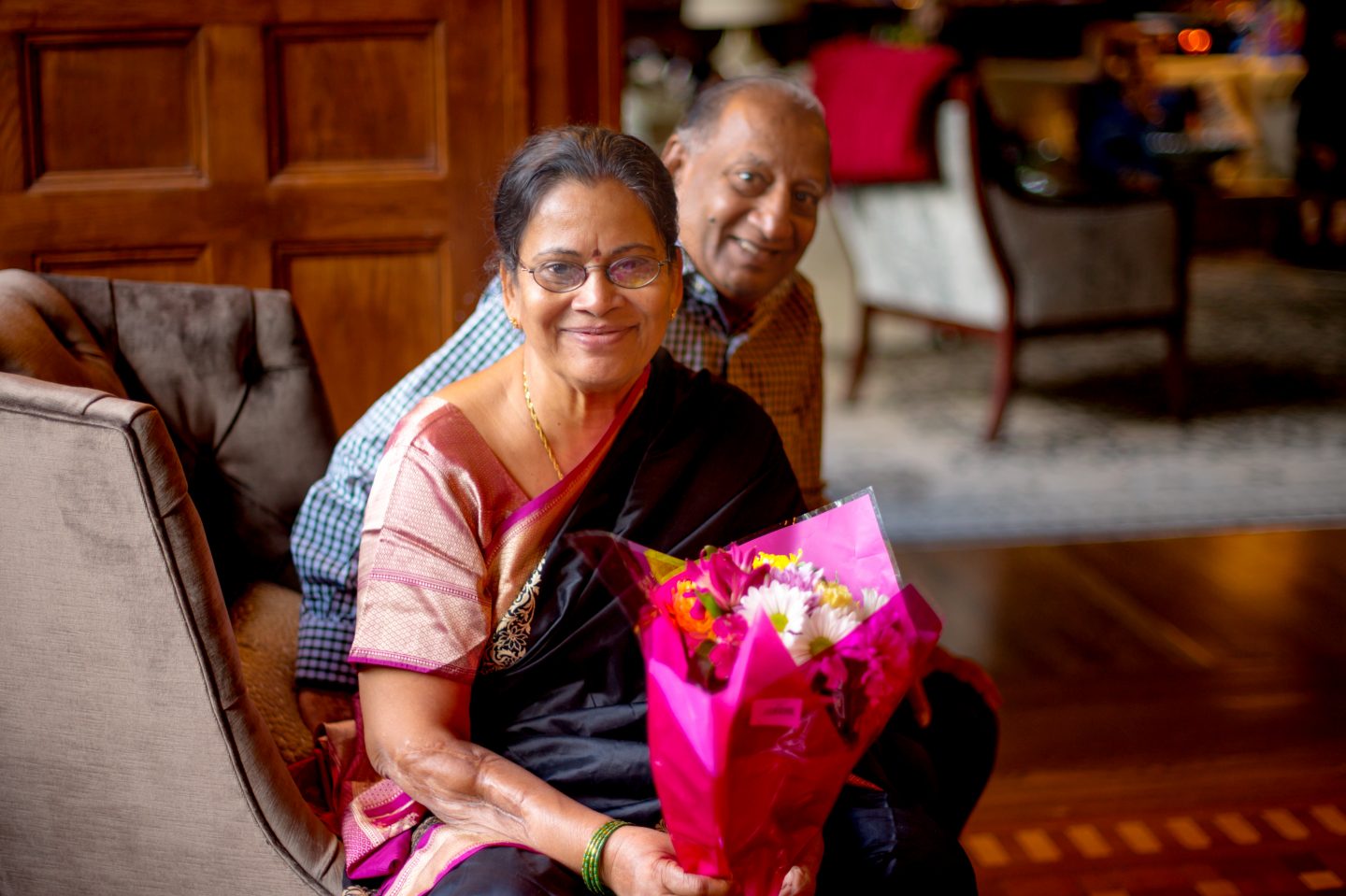 Mother holding flowers.