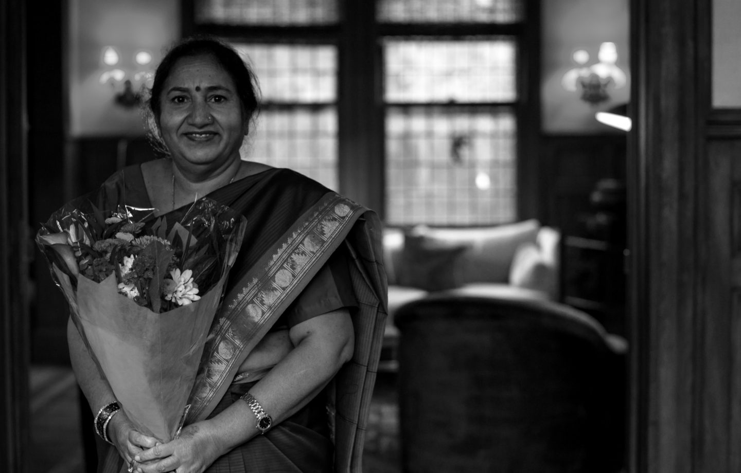 Best Mother's Day Ideas. Mother holding flowers. 