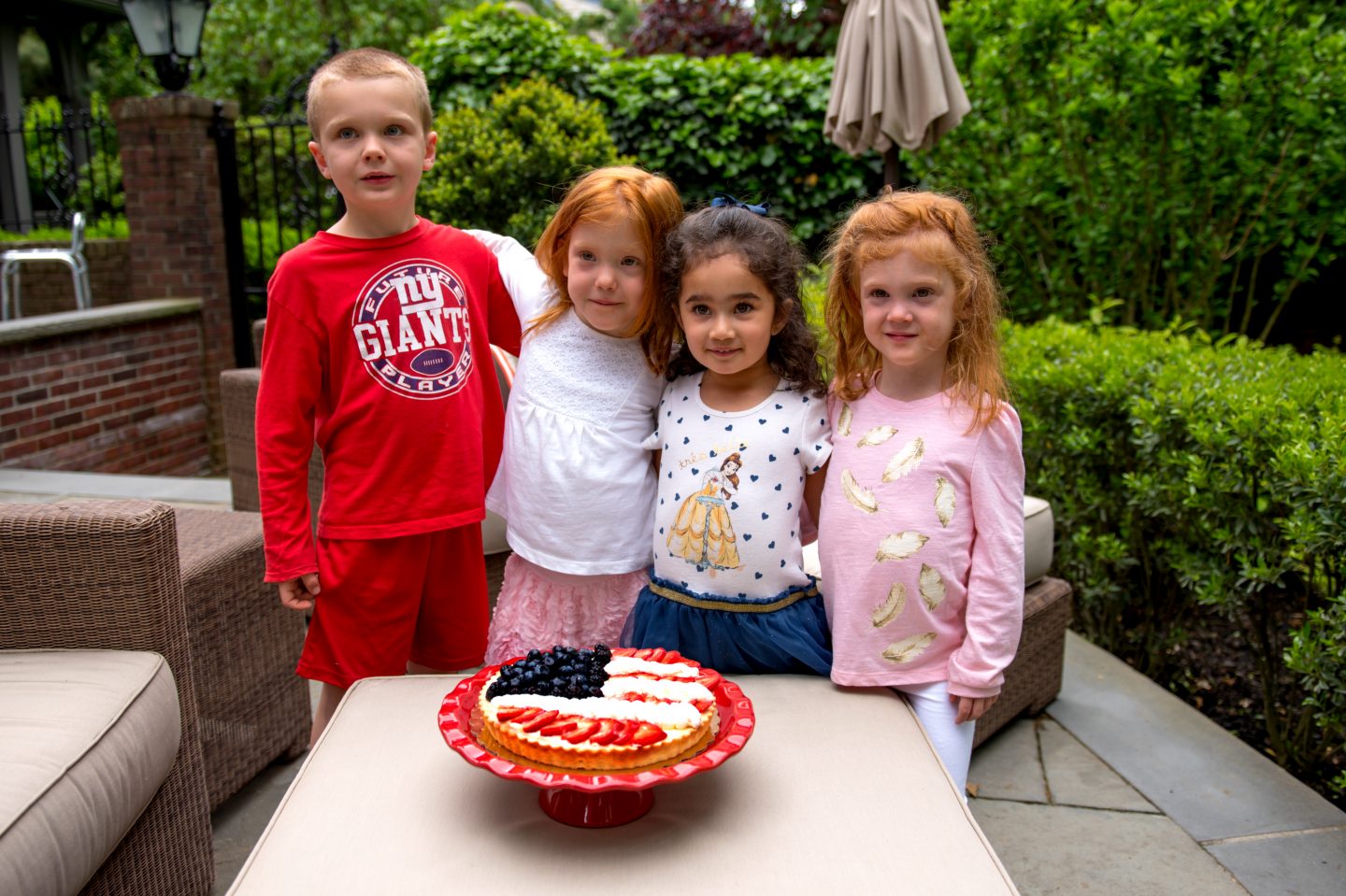 Memorial Day Dessert Ideas Featuring Red, White, and Blue. Dessert Ideas for Memorial Day. Kids with dessert. American Flag Pie. American Flag Tart. 