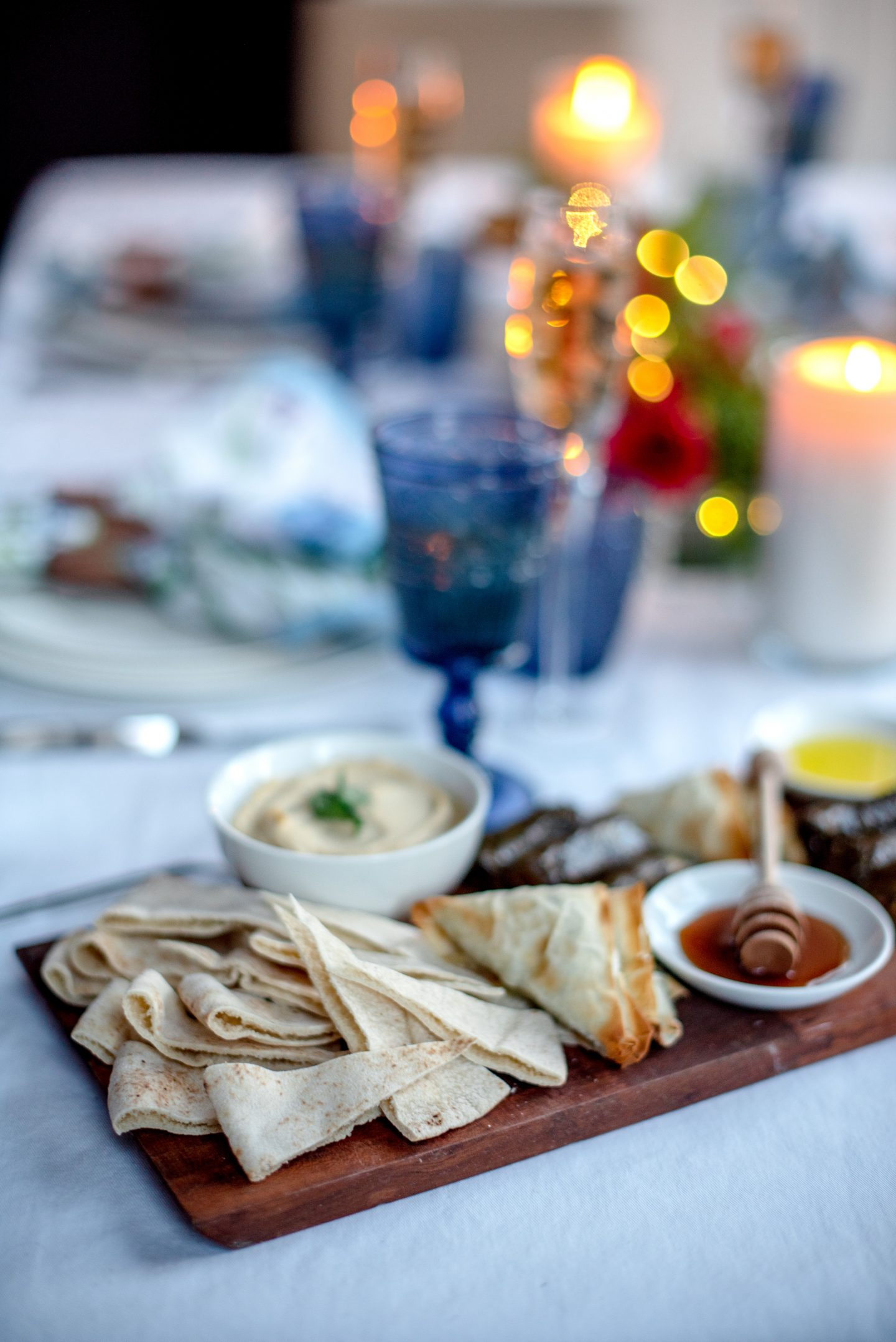 Greek Easter. Greek Easter Tablescape. Greek Easter Food. Greek Wine. Spanakopita, Hummus, Tzatziki, Mediterranean Spread. 