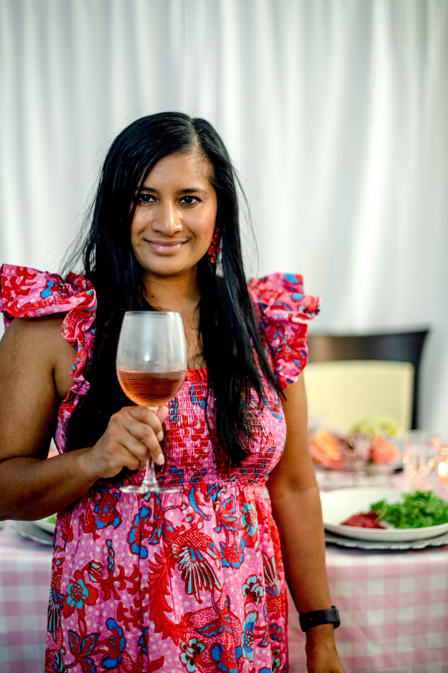 7 Best Ideas for Dinner on Mother's Day: Beautiful Tablescape and Delicious Recipes Dinner on Mother's Day. Woman drinking Robert Sinskey Rosé.