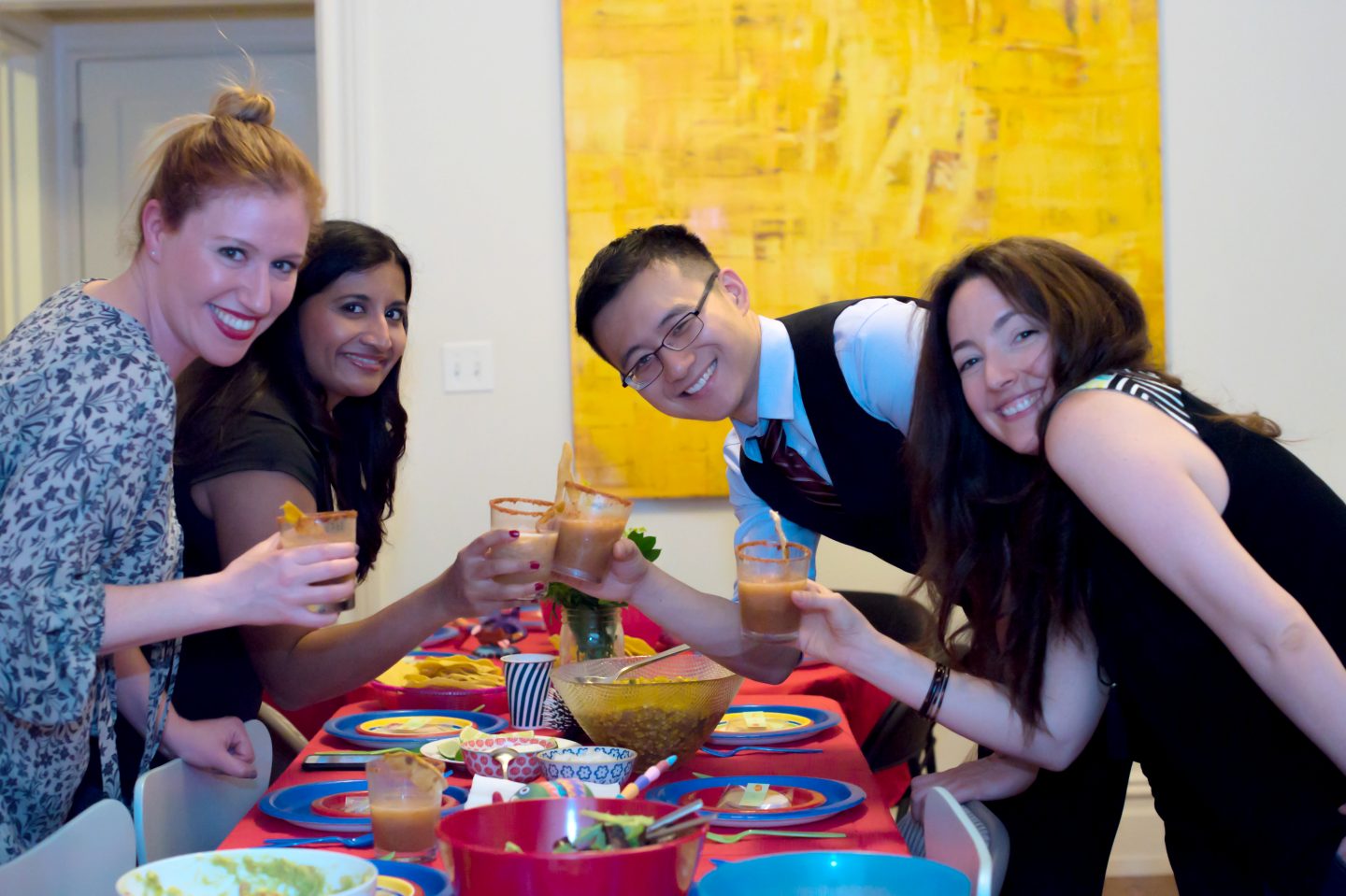 Cinco de Mayo Party Ideas. Cinco de Mayo Tablescape. Cinco de Mayo Dinner Party. Guests enjoying margaritas on Cinco de Mayo.