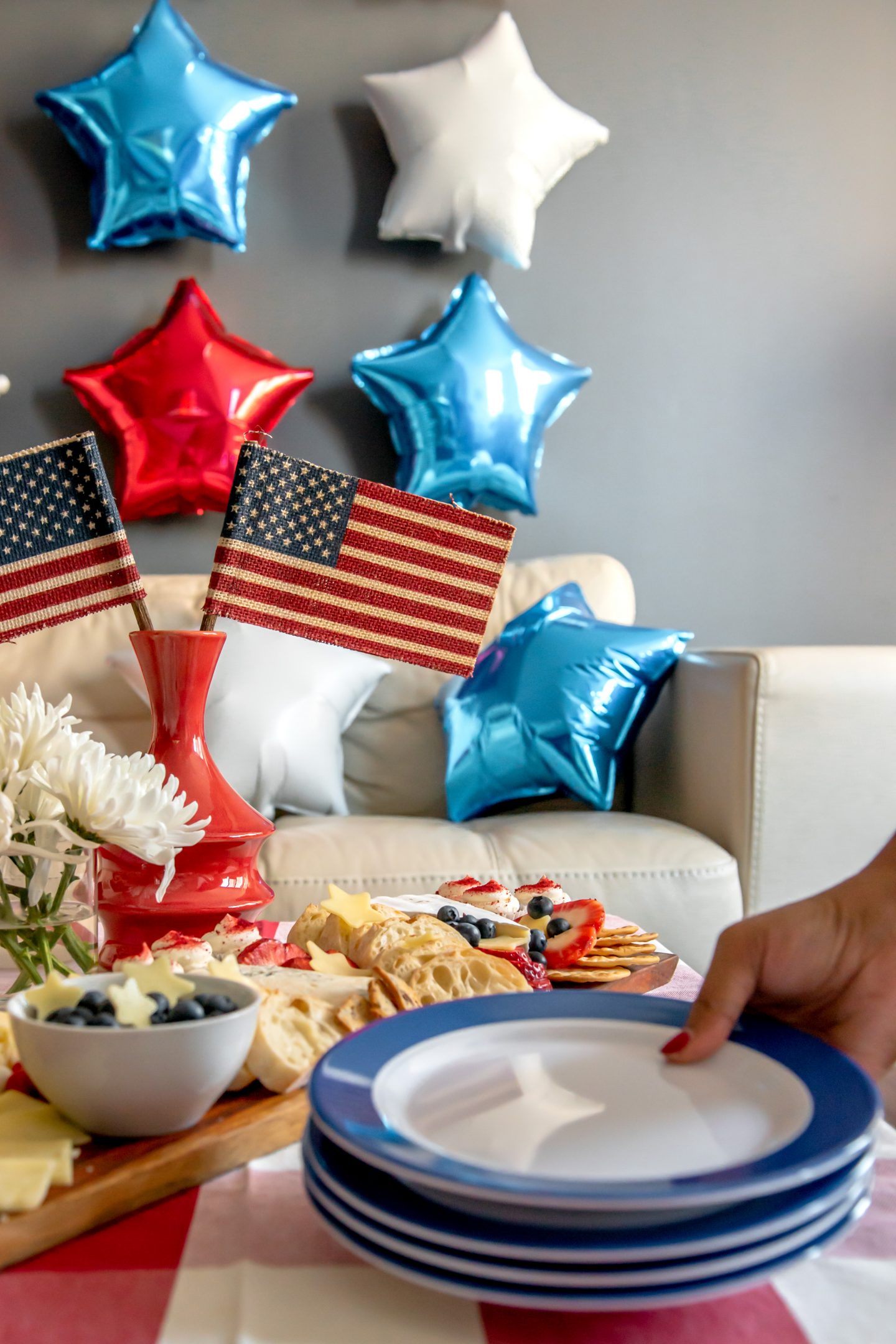 Best July 4th Decor Ideas: How to Celebrate Independence Day in Style July 4th Decor Ideas. Red, white and blue cheese board. Red and white gingham tablecloth. Red, white and blue star balloons. American flags.