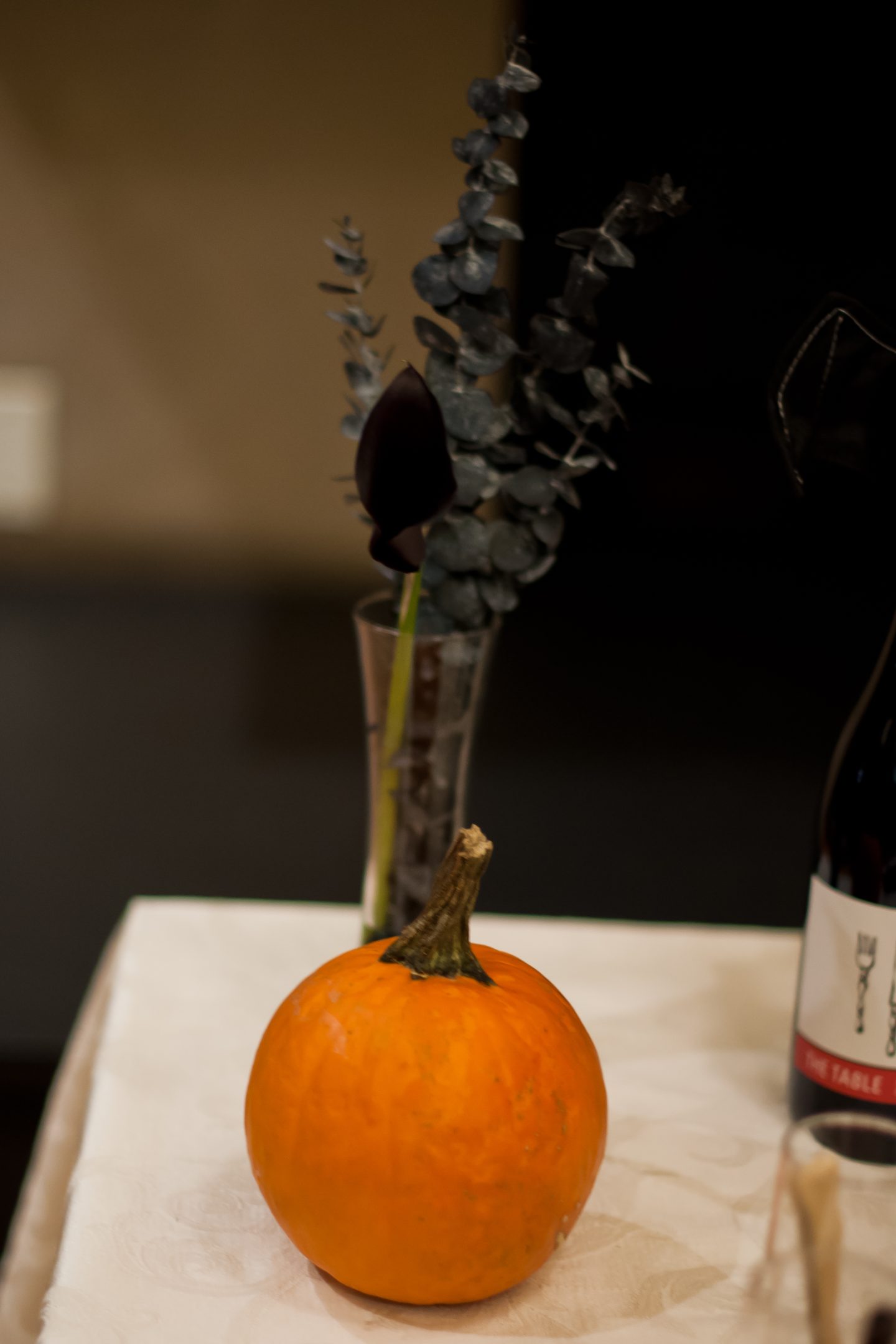 Black calla lilies. Halloween dinner party. Halloween table. Orange and black Halloween tablescape.