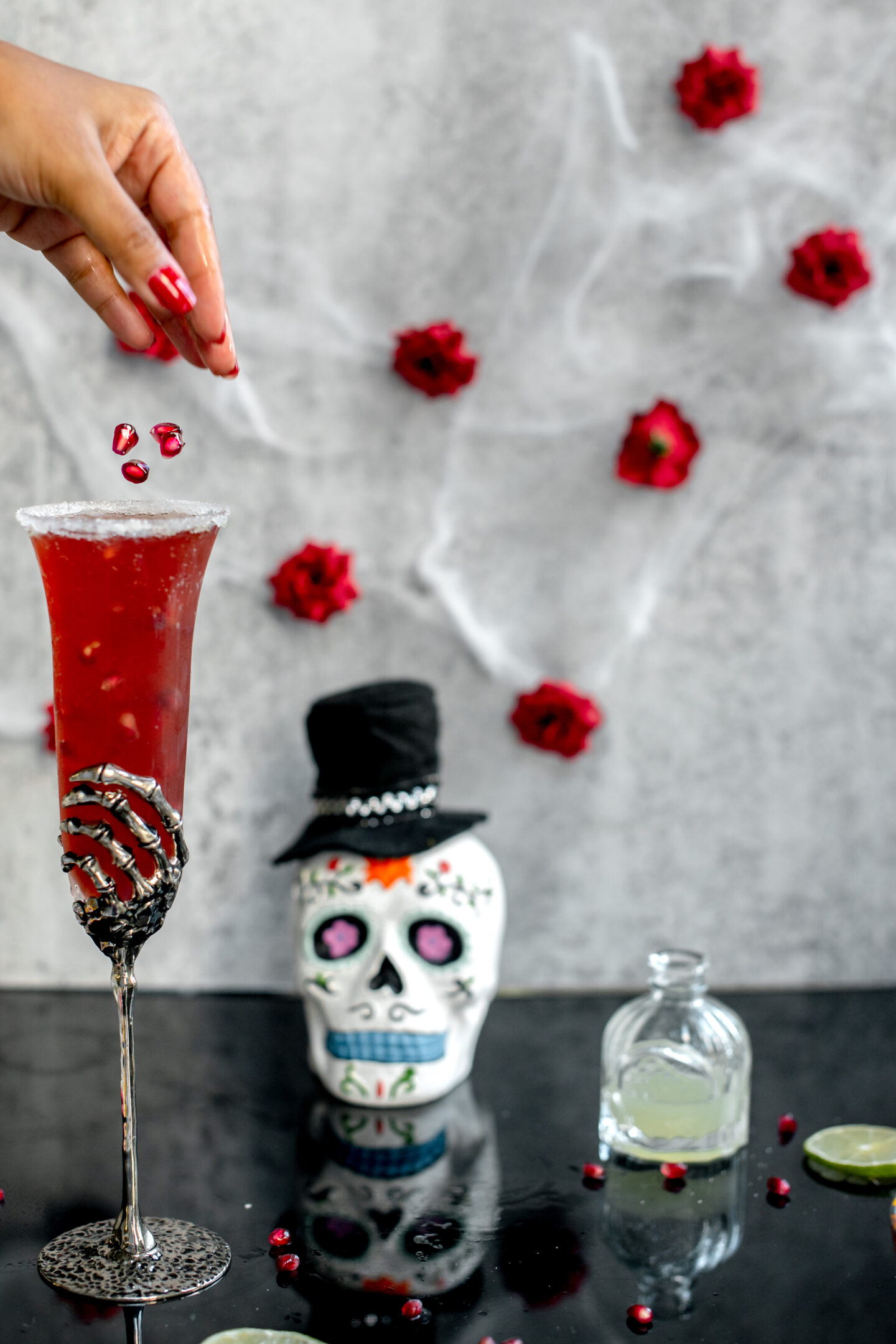 Pomegranate Champagne Margarita. Dia de los Muertos. Pottery Barn Skeleton Flute.