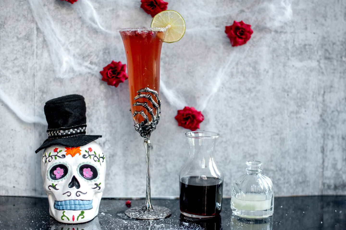 Pomegranate Champagne Margarita. Dia de los Muertos. Pottery Barn Skeleton Flute.