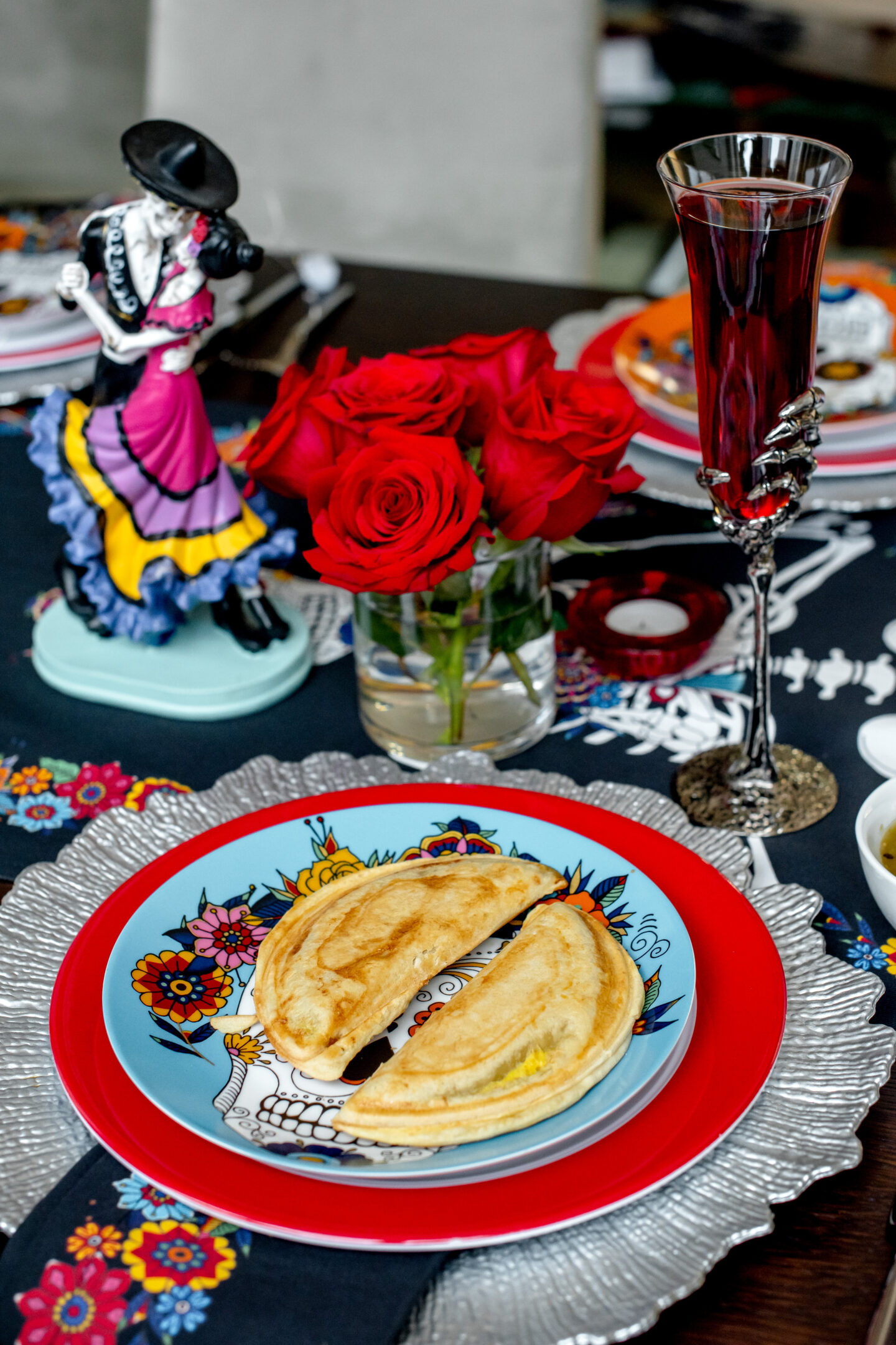 Day of the Dead Party Ideas. Dia de los Muertos. Day of the Dead Party Tablescape. Day of the Dead Tablescape.  Chicken Empanadas. Pomegranate Champagne Margarita. 