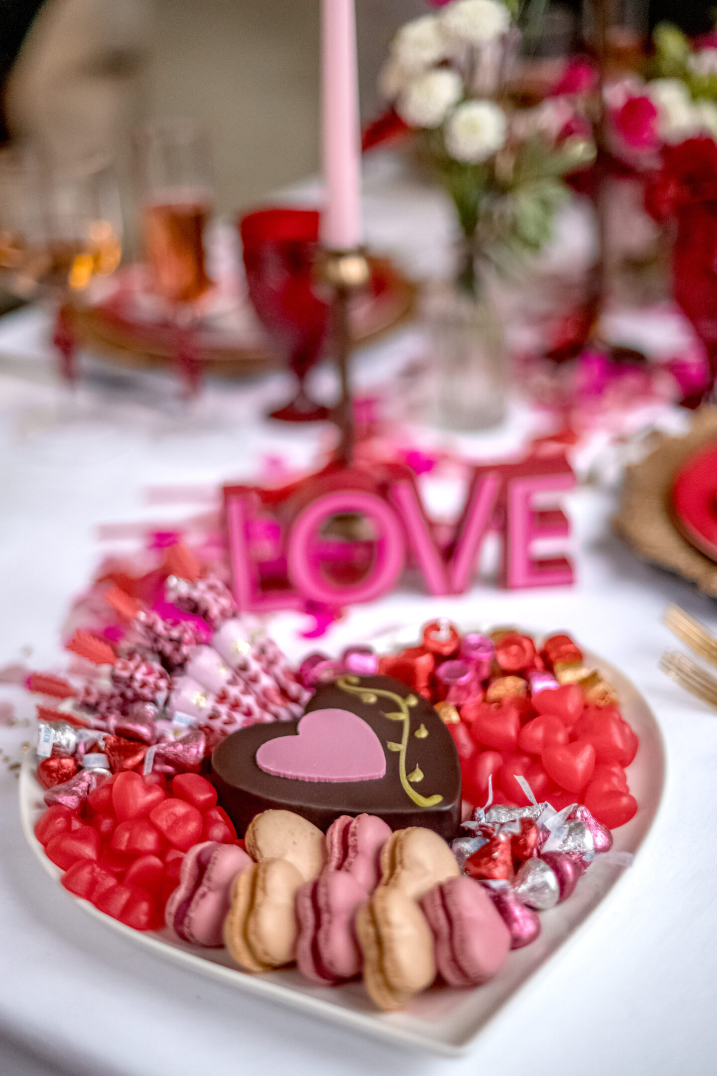 7 Irresistible Ways to Celebrate with Heart Shaped Pizza for Valentine's Day Valentine's Day party. Heart Shaped Pizza for Valentine's Day. Valentine's Day tablescape.Valentine's Day dessert board.