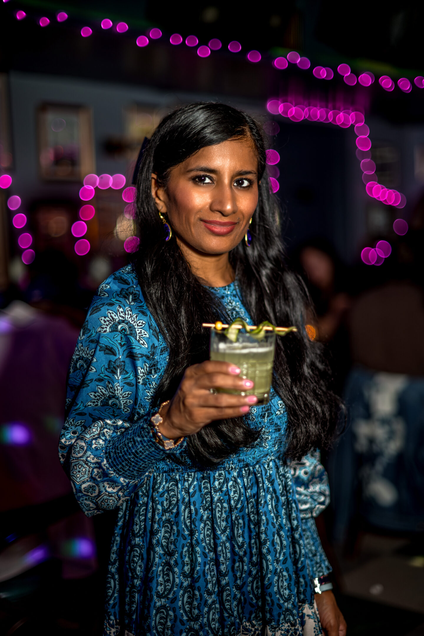 Best NYC Summer Restaurants Mean Fiddler Lady holding a drink