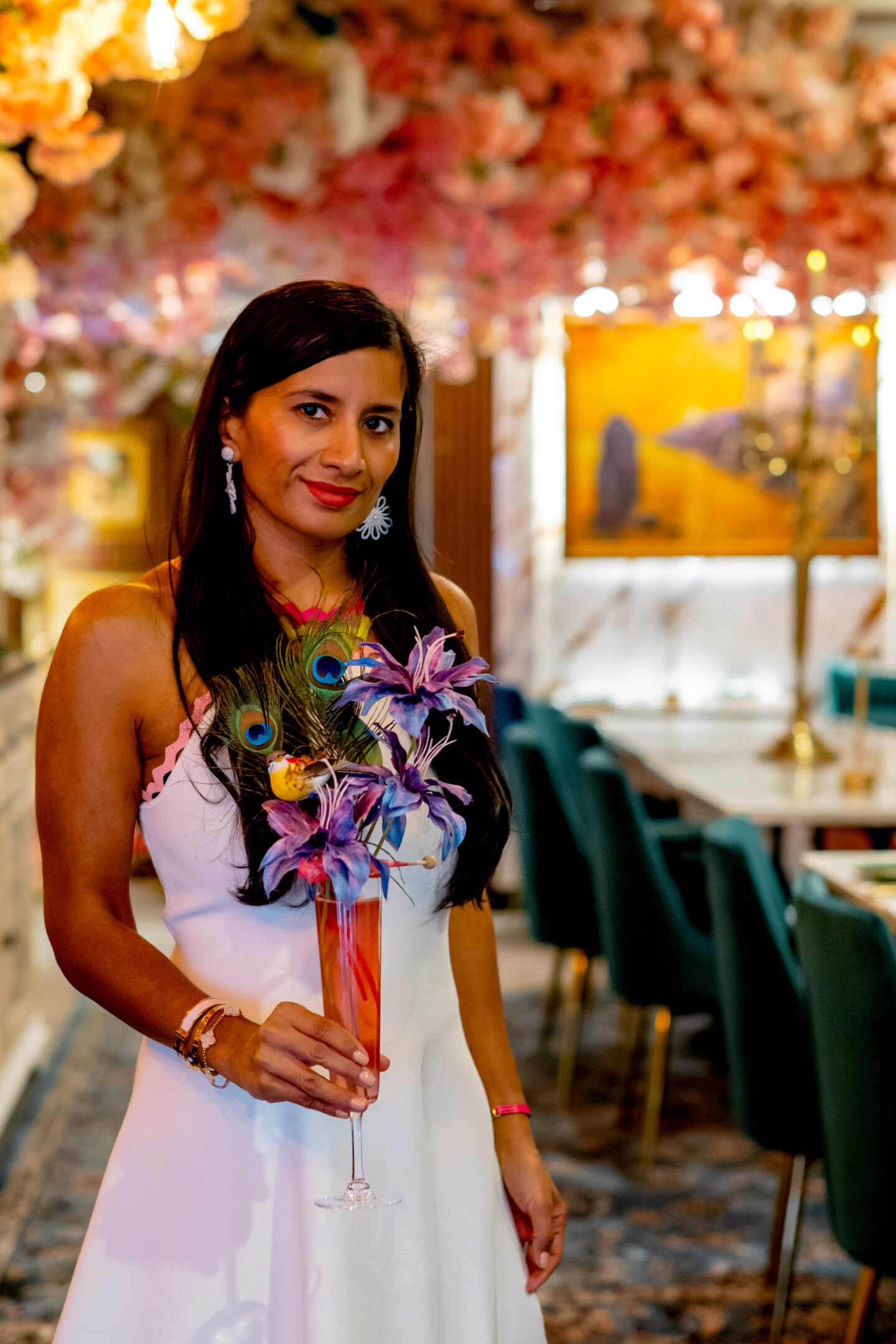 Best NYC Summer Restaurants Sveta Lady holding a drink