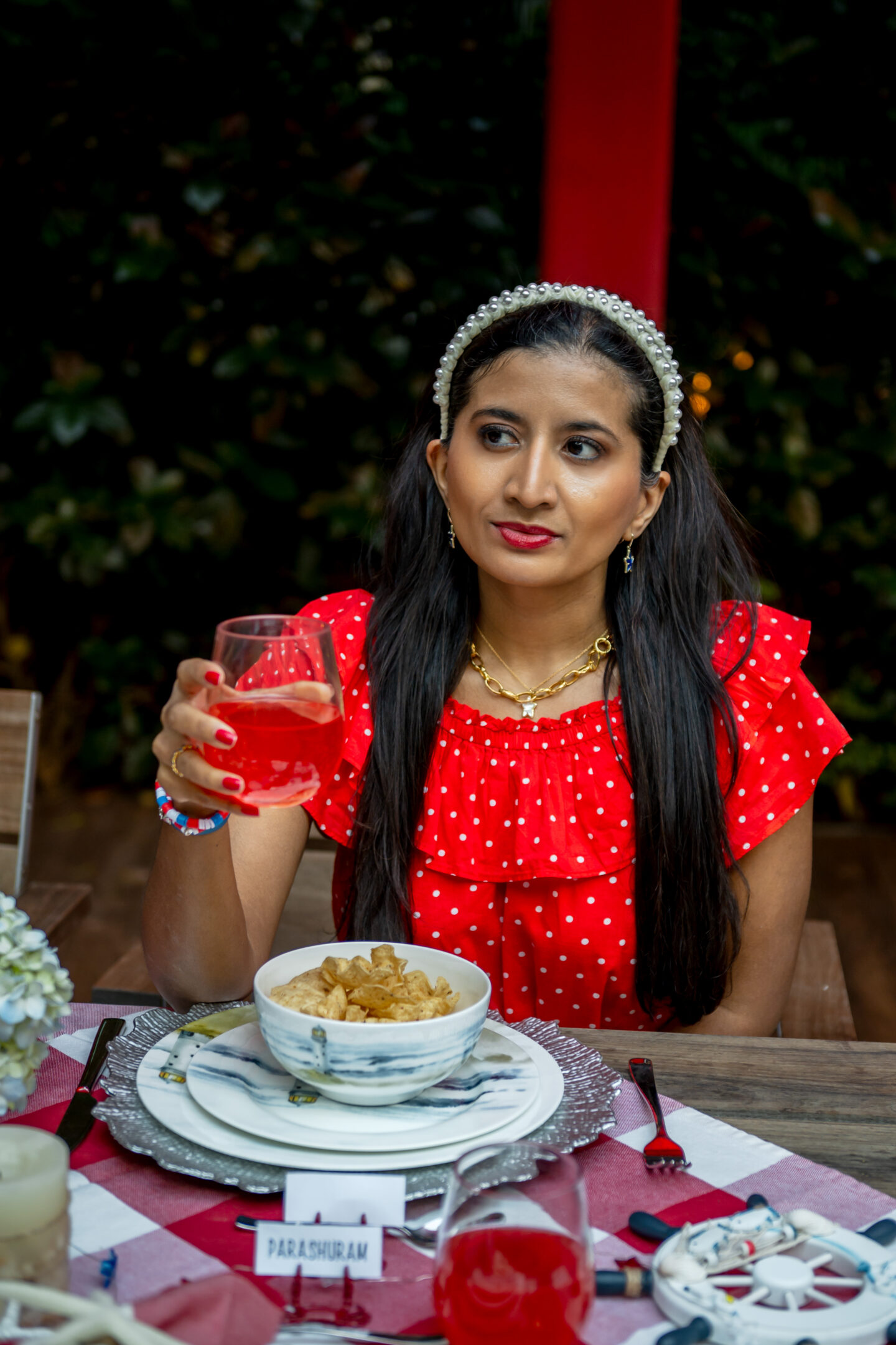 Lady drinking sparkling ice in a wine glass