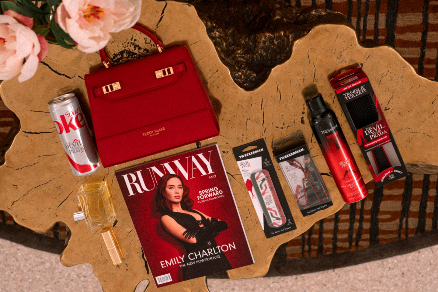5 Best Things to Wear to The Devil Wears Prada Two Screening The Devil Wears Prada Two Screening: Runway Magazine, Diet Coke, Prada Perfume, L'Oreal Lipstick, TRESemmé Sprays, Teddy Blake Purse