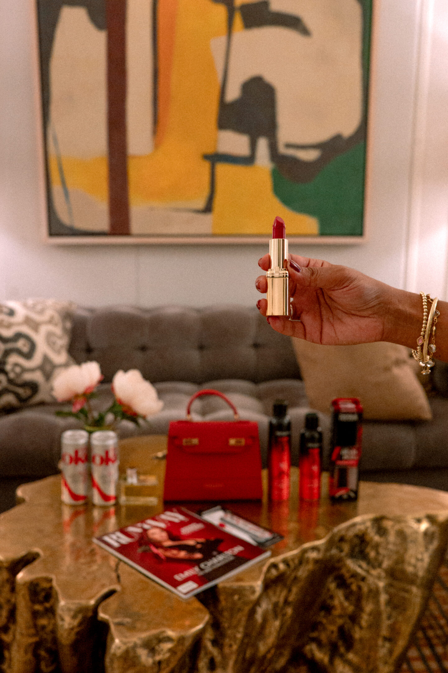 5 Best Things to Wear to The Devil Wears Prada Two Screening The Devil Wears Prada Two Screening: Runway Magazine, Diet Coke, Prada Perfume, L'Oreal Lipstick, TRESemmé Sprays, Teddy Blake Purse