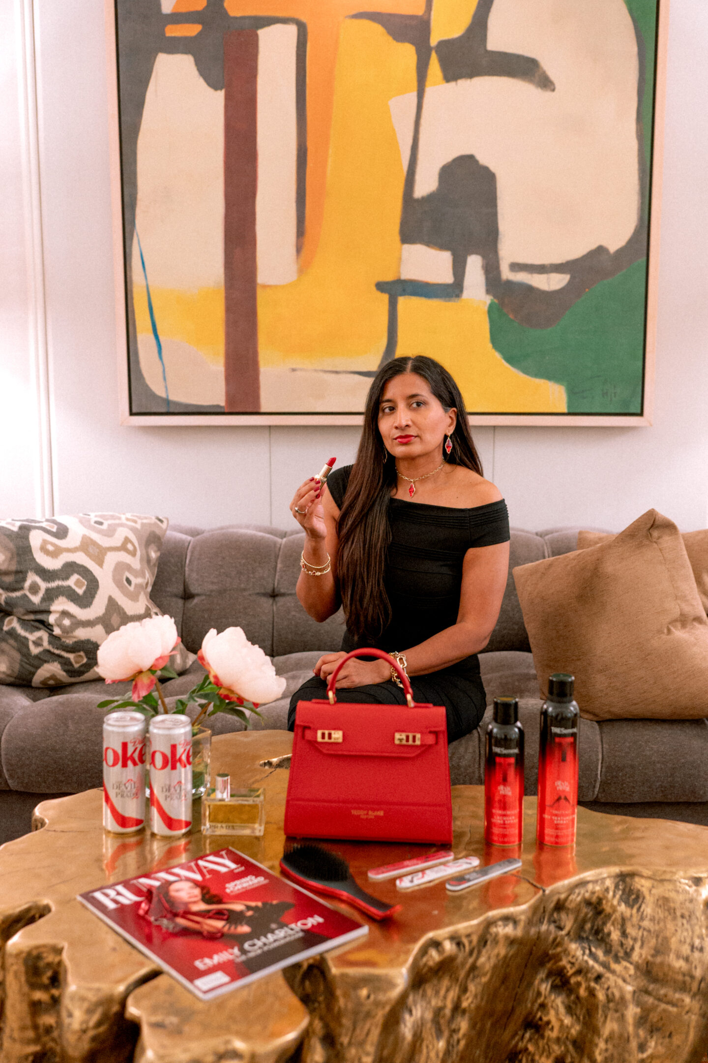 5 Best Things to Wear to The Devil Wears Prada Two Screening The Devil Wears Prada Two Screening: Runway Magazine, Diet Coke, Prada Perfume, L'Oreal Lipstick, TRESemmé Sprays, Teddy Blake Purse